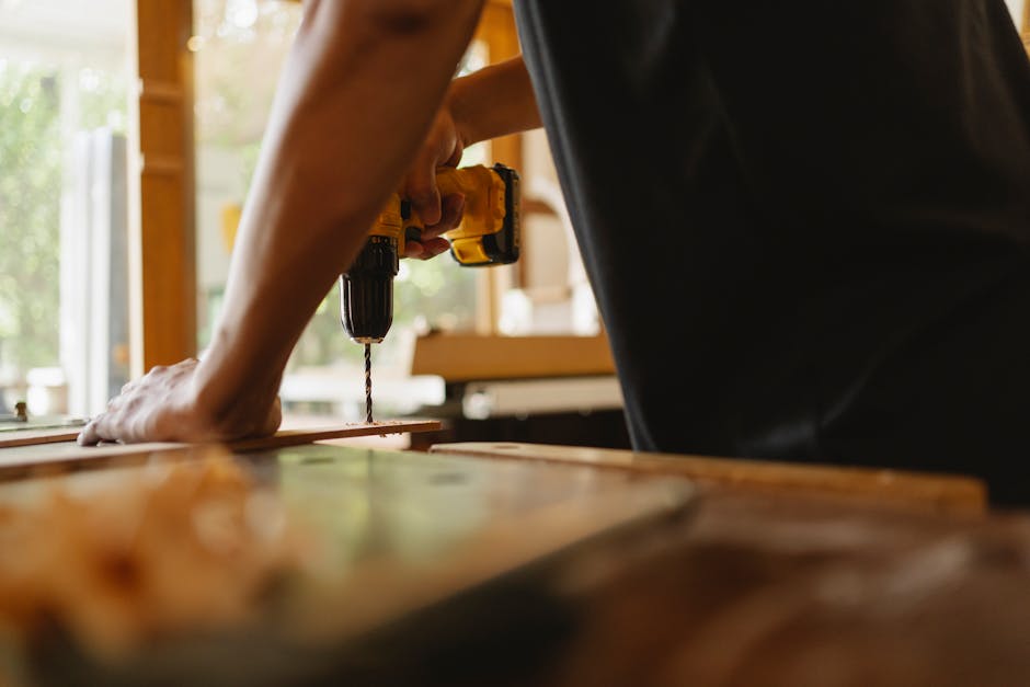 Carpenter installing a precise wooden door